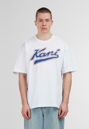 White cotton t-shirt with a round neck and short sleeves, featuring a prominent blue and red "Kani" logo on the front. Casual fit.