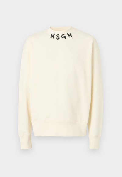 Sweatshirt de couleur crème avec le lettrage noir "MSGM" sur le col. Il présente des manches longues et une coupe décontractée. Fabriqué à partir d'un matériau doux.