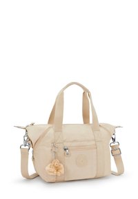 Borsa Kipling beige con doppi manici, tracolla regolabile, tasca frontale con zip e portachiavi a forma di scimmia morbido attaccato.