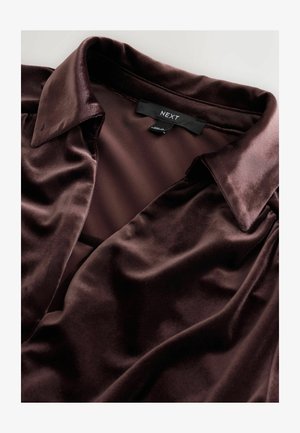 Dark brown satin blouse featuring a classic collar, soft texture, and subtle sheen; labeled with "NEXT" inside the collar.