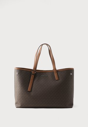 Brown Michael Kors tote bag with double leather straps, adjustable buckle, and embossed logo pattern, set against a plain background.