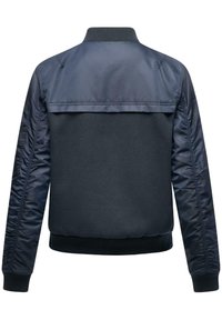 Navy bomber jacket featuring a combination of smooth nylon and textured fabric, ribbed collar, and elastic cuffs with gathered sleeves.