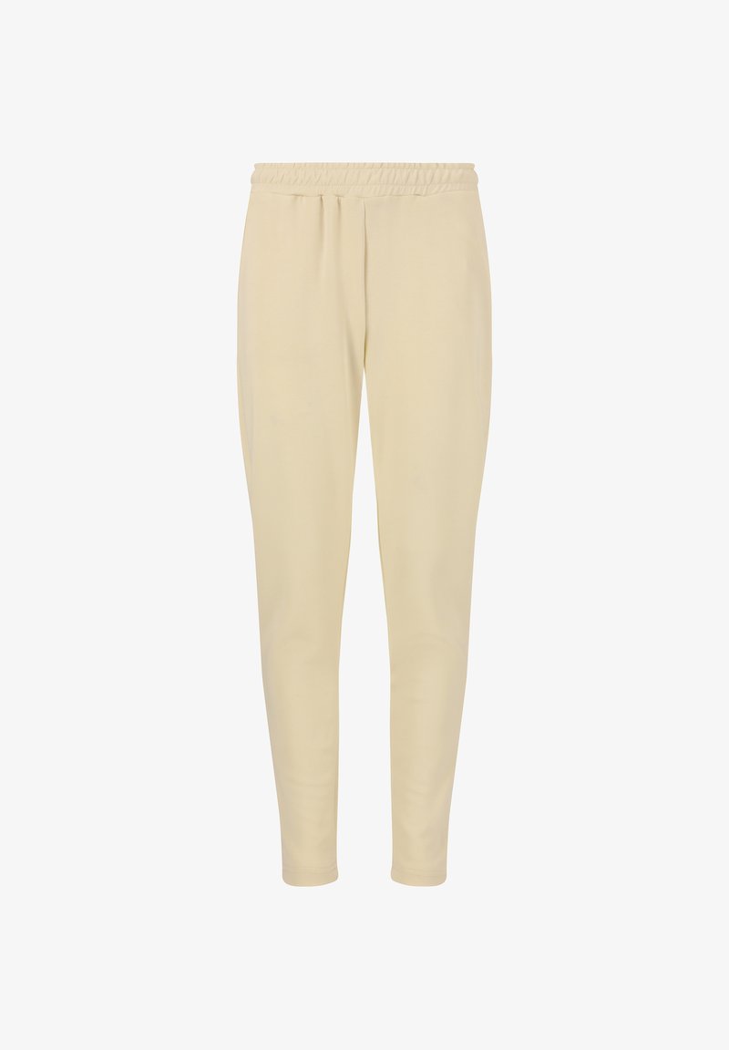 Cremefarbene, dehnbare Jogginghosen mit einem elastischen Bund, schmal zulaufenden Beinen und glatter Textur. Keine sichtbaren Muster oder Akzente.