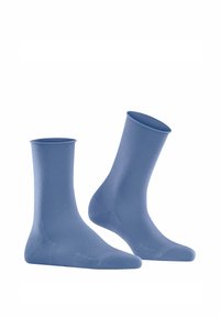 Niebieskie bawełniane skarpetki o gładkiej fakturze, sięgające do połowy łydki, z prążkowanymi mankietami. Prosty design bez widocznych logo i wzorów.