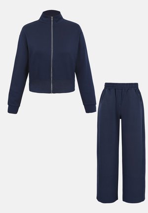 Veste zippée bleu marine avec ourlet côtelé et pantalon large assorti à taille élastique et poches latérales.