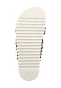 Rubber sandal sole, textured with horizontal grooves in white plastic, rounded toe, with small circular cutouts along sides, labeled “Havanas.”
