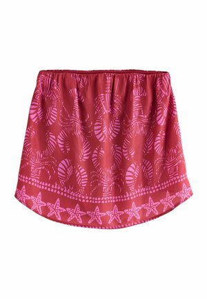 Falda roja con patrón rosa que presenta formas abstractas y motivos de estrellas en el dobladillo. Cintura elástica para un ajuste ajustable. Textura de tela suave.