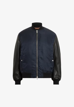 Navy bomber jacket with black leather sleeves, ribbed cuffs and hem, zip front closure, and side pockets. Smooth texture with contrasting materials.