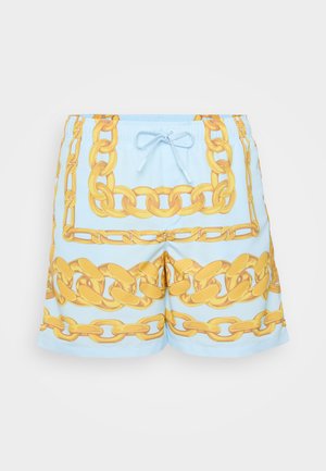 Peldbikses ar gaiši zilu fona krāsu un drosmīgu dzeltenu ķēžu rakstu. Elastīga josta ar aukliņu.