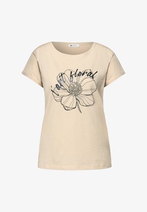 Maglietta beige a maniche corte con un grande fiore contornato di nero e testo in corsivo "stay floral" sul davanti.