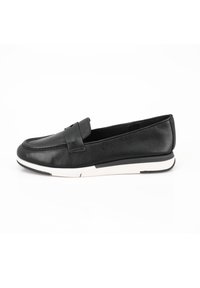 Black leather loafer with a stitched toe design, cushioned sole, and white rubber outsole. Features a decorative band across the upper.