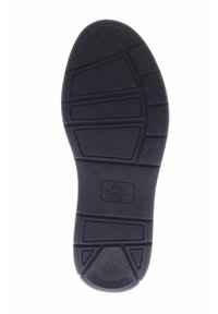 Black rubber shoe sole featuring textured patterns and grooves, with logo "Finn Comfort" and size "39" embossed.
