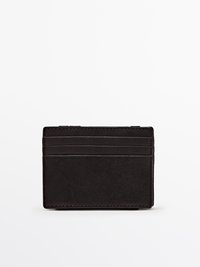 Black leather cardholder with a textured finish, featuring four vertical card slots and a slim, rectangular shape.