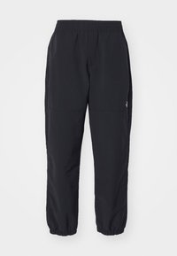 EASY WIND PANT - Teplákové kalhoty - black