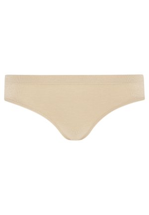Beige damesstring van zacht materiaal. Heeft een gladde tailleband met een naadloos ontwerp en geen zichtbare stiksels voor comfort.