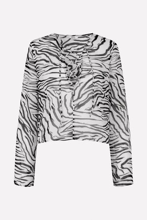 Prozirni crno-bijeli kratki top s uzorkom zebre, s dugim rukavima i detaljem vezanja na vratu.