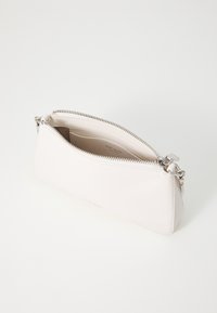 White leather clutch bag with a smooth texture, featuring a silver zipper and a compact design. Inside includes card slots.