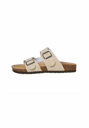 Sandalo beige slip-on con due cinturini con fibbia regolabili, plantare in sughero e suola nera testurizzata, visto di lato.