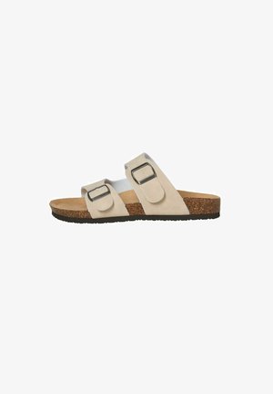 Sandalo beige slip-on con due cinturini con fibbia regolabili, plantare in sughero e suola nera testurizzata, visto di lato.