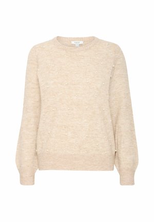 Beige sweater with a round neckline, featuring a textured surface and pearl-like accents evenly distributed. Long sleeves with ribbed cuffs.