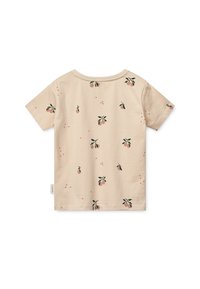 Short-sleeve beige t-shirt featuring a pattern of small peach-like fruit and green leaves, made from soft, lightweight fabric.