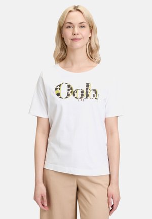 T-shirt en coton blanc avec un grand graphisme coloré "Ooh" rehaussé de motifs animaliers. Manches courtes et col rond.