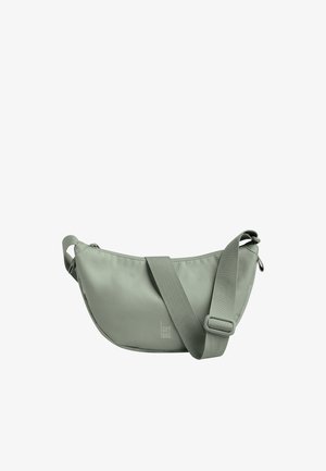 Hellgrüne Umhängetasche mit breitem, verstellbarem Riemen und Reißverschluss, mit kleinem "GOT BAG" Logo vorne.