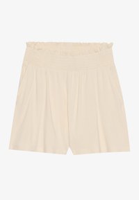Shorts en coton couleur crème avec une taille smockée, coupe décontractée, poches latérales et texture douce. Design simple sans motifs visibles.