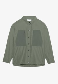 Green long-sleeve shirt with a structured collar, button front, and two large patch pockets in a darker green, made of lightweight fabric.