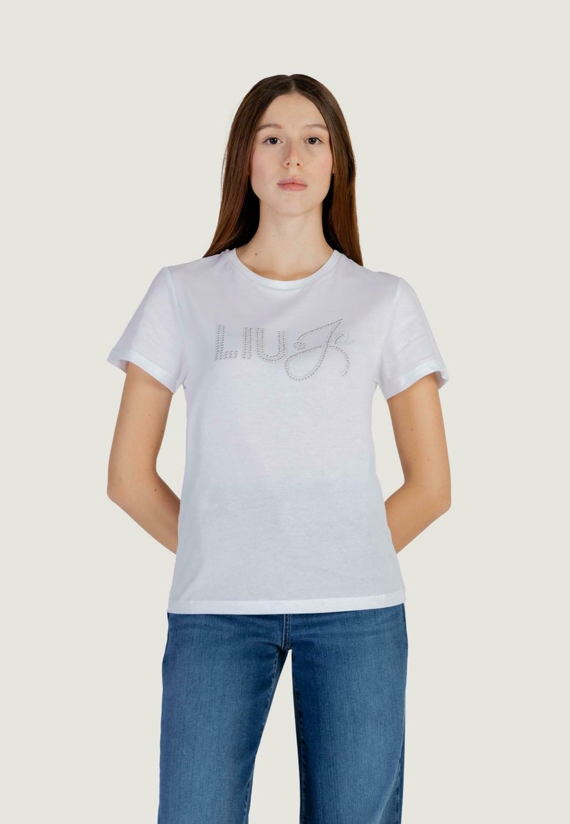White cotton t-shirt featuring short sleeves, round neckline, and embellished "LIU J" logo in rhinestones across the chest.