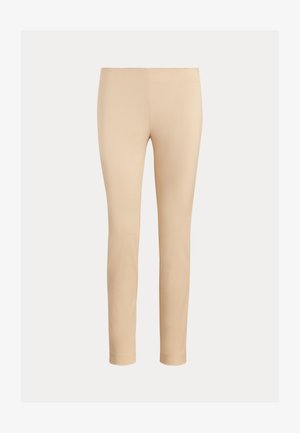 Beige, slanke, ankellange bukser til kvinder med en glat struktur uden synlige lommer eller udsmykninger.