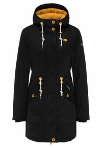 Svart parka-jacka med gul foder, dragsko-huva och två sidofickor. Utrustad med metallknappar och dekorativa metalldetaljer.