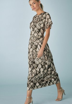 Maxi dress in cream and black snake print, short flutter sleeves, fitted silhouette, with a smooth texture and slight sheen, above ankle length.