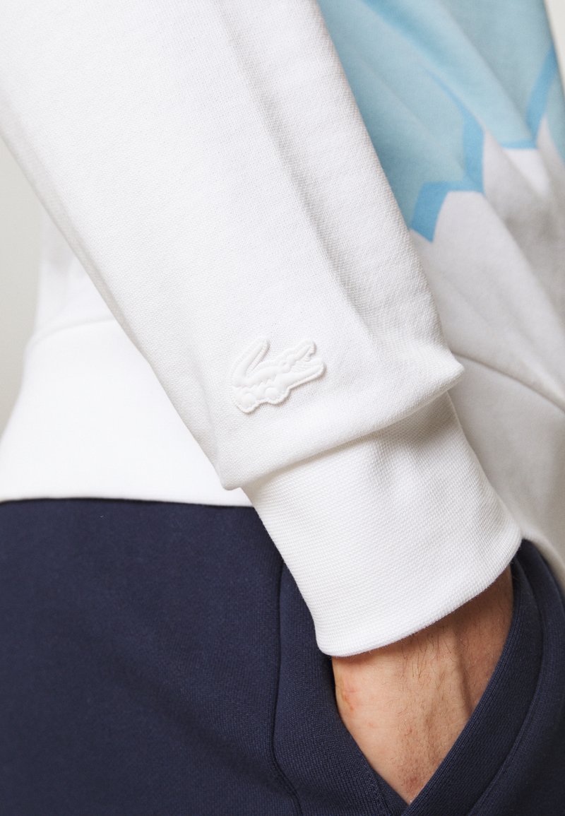Herren Kapuzenpullover | Lacoste Sweatshirt white/weiß - HX64710 Herren Kapuzenpullover | Lacoste Sweatshirt white/weiß - HX64710