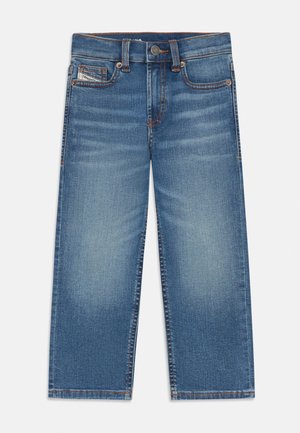 Sinised teksapüksid pleekinud esiküljega, viis taskut, sealhulgas münditasku sildiga, nööpkinnitusega ja kontrastõmblustega.