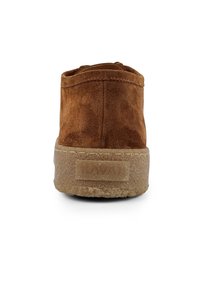 Brown suede ankle boot with a textured surface, offering a rounded design and a thick rubber sole. Stamped logo on the heel.