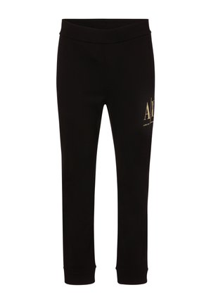 Schwarze eng anliegende Hose mit elastischem Bund und goldfarbenem Armani Exchange-Logo am oberen Oberschenkel.