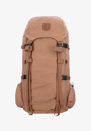 Brown nylon backpack with adjustable straps, large main compartment, logo patch, side pockets, and reinforced buckles for durability.