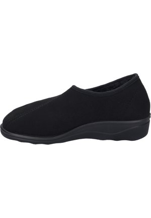 Black slip-on shoe made of soft fabric with a smooth texture, featuring a low rubber sole and stitched detailing on the upper.