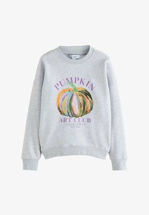 Light gray sweatshirt with a colorful pumpkin illustration and purple text reading "PUMPKIN ART CLUB" with Japanese characters and "TOKYO JAPAN".