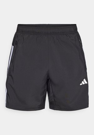 Čierne športové šortky z ľahkej látky, s elastickým pásom, bočnými vreckami so zipsom a bielym logom Adidas so pruhmi.