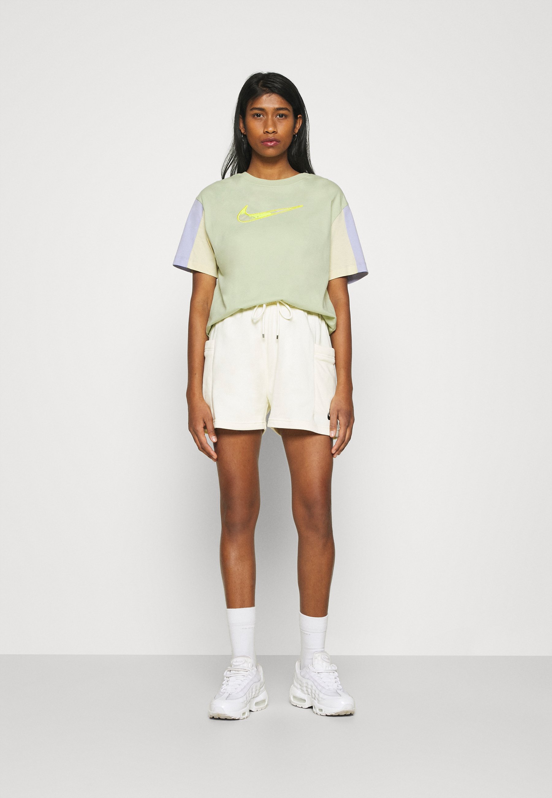 white and olive green nike shirt