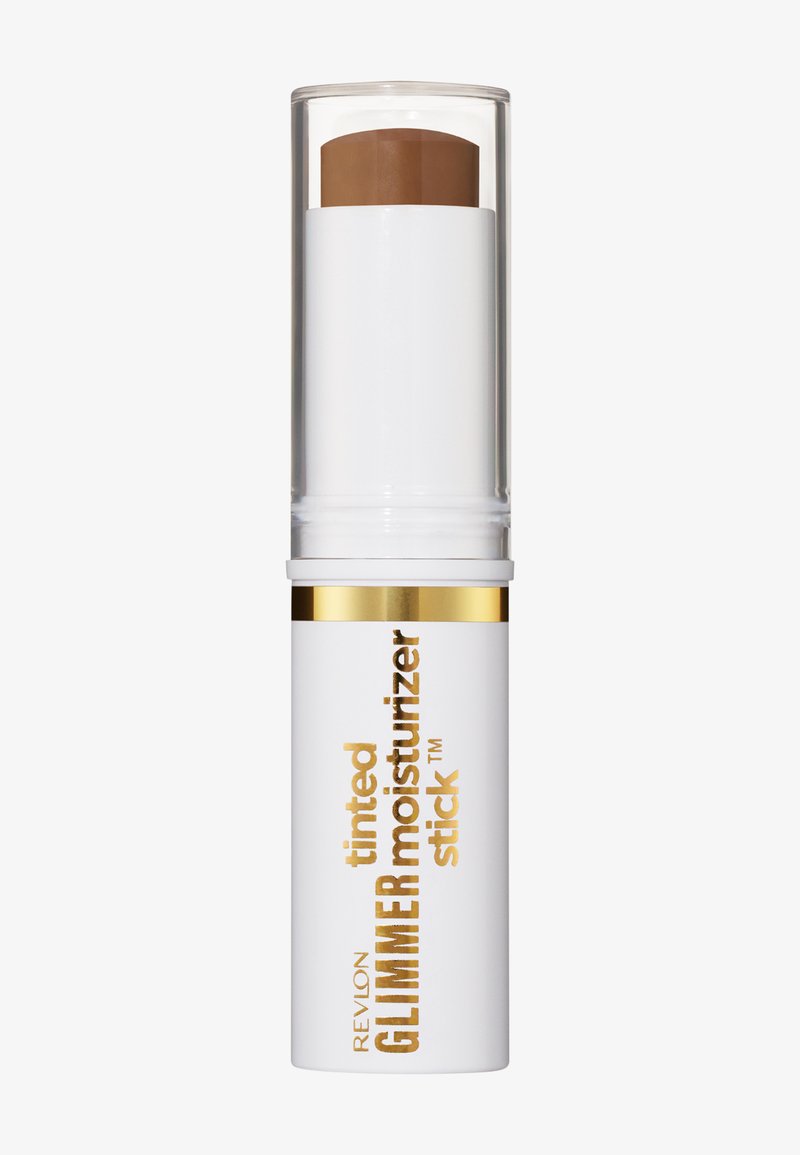 Stick hydratant teinté Revlon Glimmer en teinte brun clair, tube blanc avec accents dorés et bouchon transparent.