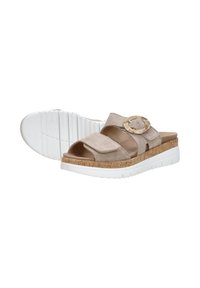 Beige suede slide sandals with two adjustable straps, a circular gold buckle accent, and a white, textured platform sole.