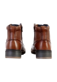 Brown leather ankle boots with a textured finish, zip closure, and contrasting blue interior. Features a sturdy black heel.