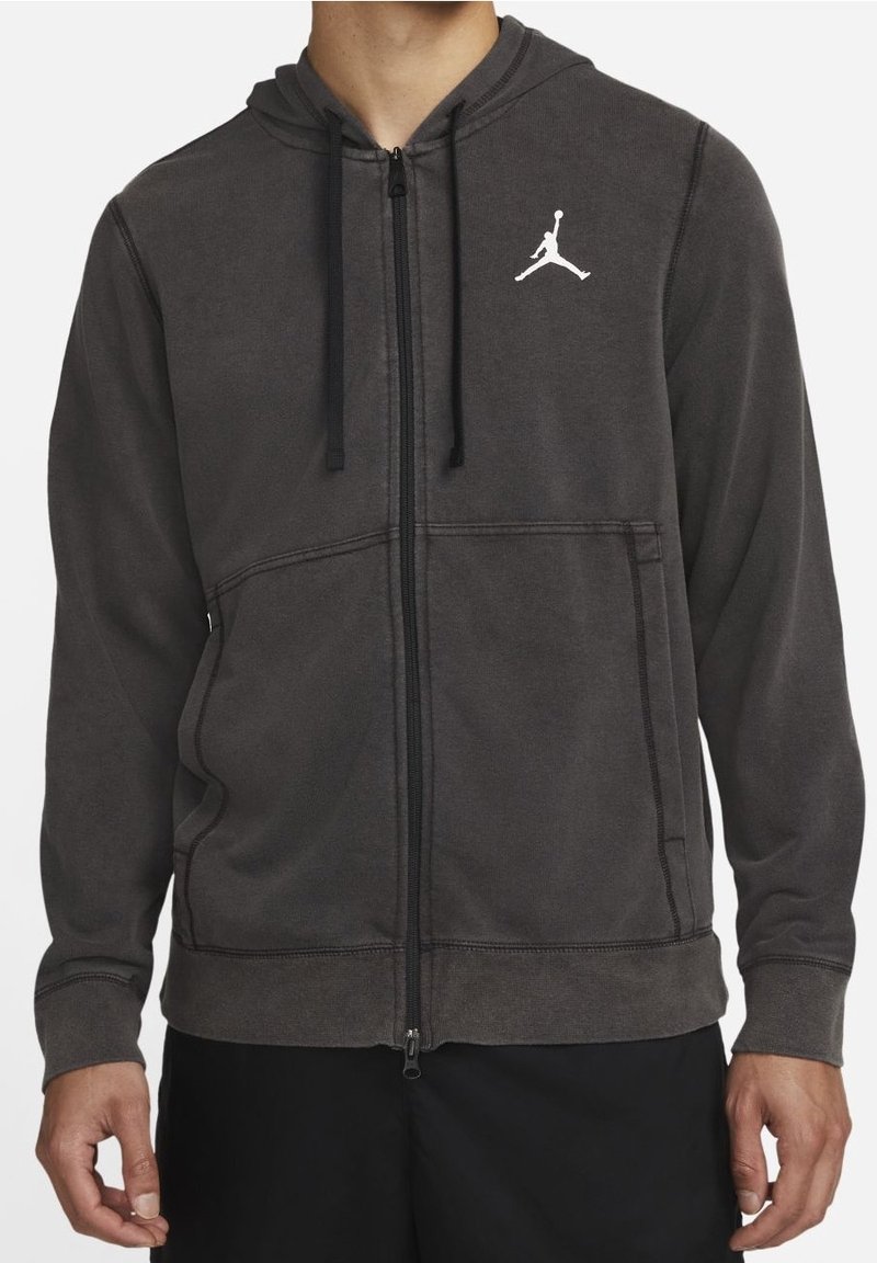 Felpa con zip grigia scura e finitura testurizzata, dotata di tasca a marsupio frontale e logo Jumpman bianco sul lato sinistro del petto.
