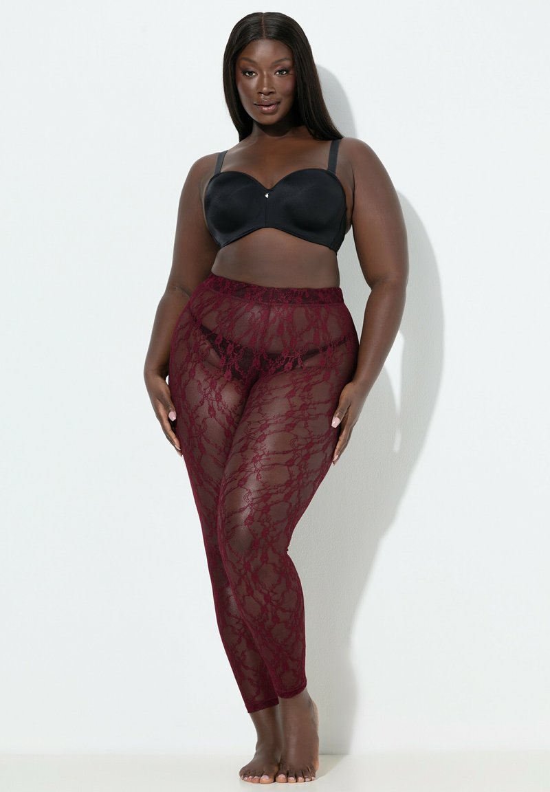 Czarny biustonosz z fiszbinami oraz przezroczyste burgundowe legginsy z koronką w kwiatowy wzór, gładka tekstura, dopasowany krój i wysoki stan.