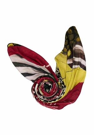 Multicolored fabric scarf rolled into a spiral with visible red, yellow, black, white, and brown irregular patterns on a white background.