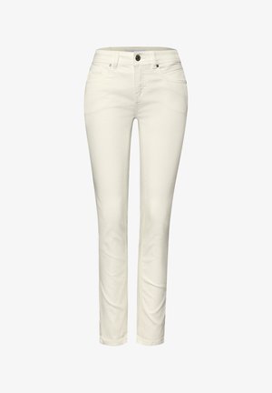 Pantalon slim pour femme de couleur crème avec fermeture avant à boutons et fermeture éclair, passants pour ceinture, et design à cinq poches.