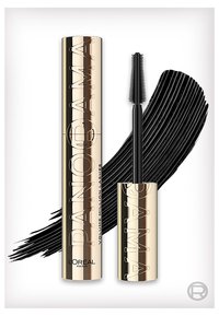 Guld tube og børste fra L'Oréal Paris Volume Million Lashes mascara med sort mascara streg i baggrunden.